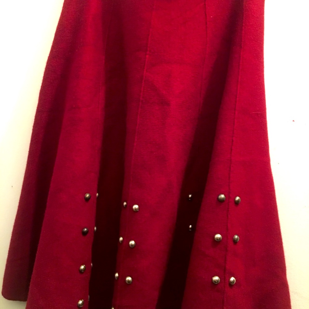 A maroon/red buttoned skirt